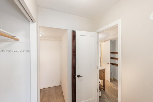 corridor featuring wood-type flooring