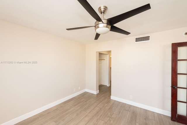 unfurnished room featuring ceiling fan and light hardwood / wood-style floors