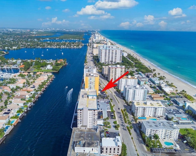 bird's eye view featuring a beach view and a water view