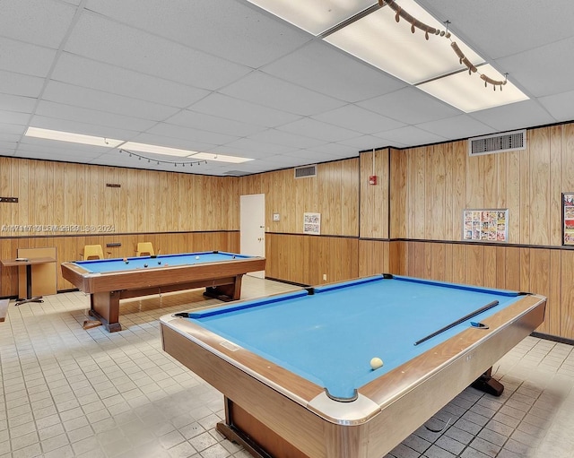 recreation room with wooden walls, a drop ceiling, and billiards