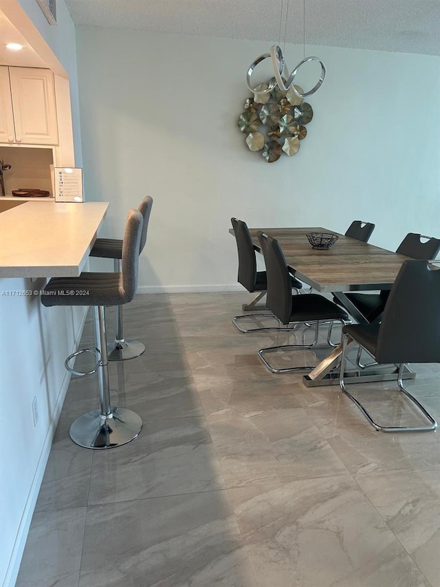 dining room with a textured ceiling