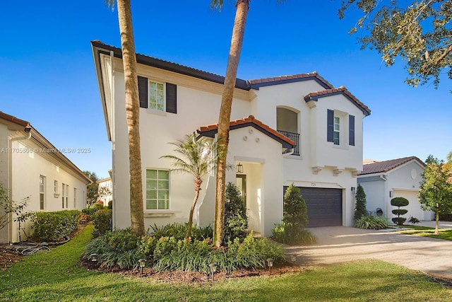 mediterranean / spanish house with a garage