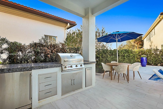 view of patio / terrace with a grill and an outdoor kitchen