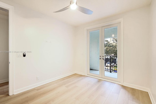 unfurnished room with ceiling fan, french doors, and light wood-type flooring