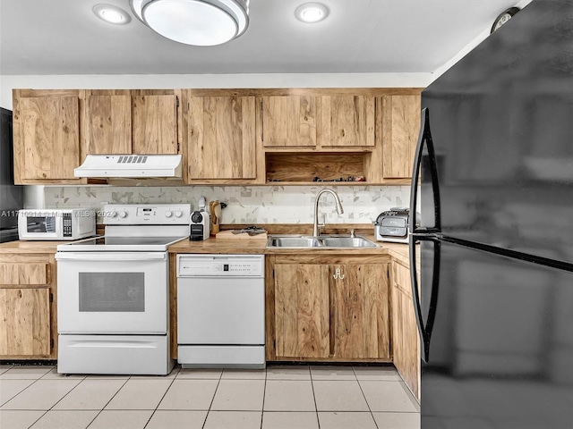 kitchen featuring under cabinet range hood, white appliances, a sink, light countertops, and open shelves