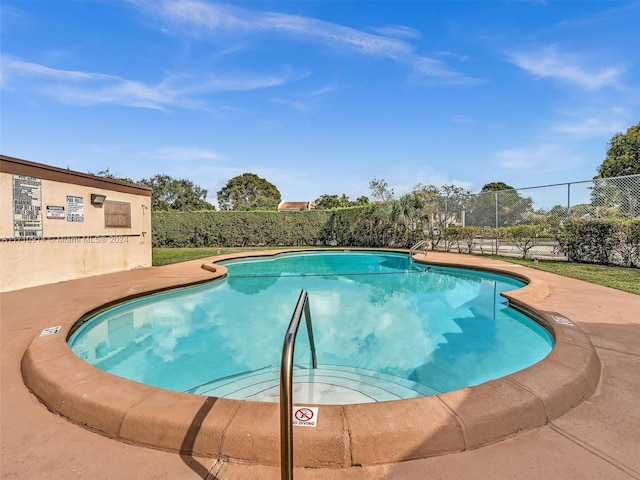 view of pool featuring fence and a fenced in pool