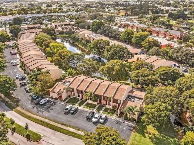 birds eye view of property featuring a residential view and a water view