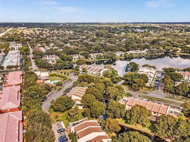 drone / aerial view with a residential view and a water view