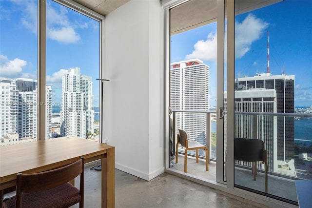 interior space featuring a wealth of natural light, expansive windows, and concrete floors