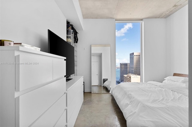 bedroom with concrete flooring