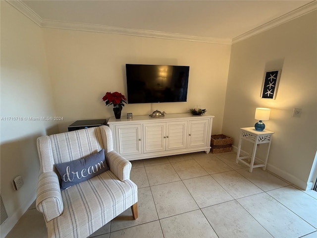 sitting room featuring ornamental molding and light tile patterned floors