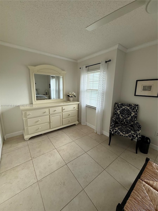 interior space featuring tile patterned flooring, vanity, a textured ceiling, and crown molding