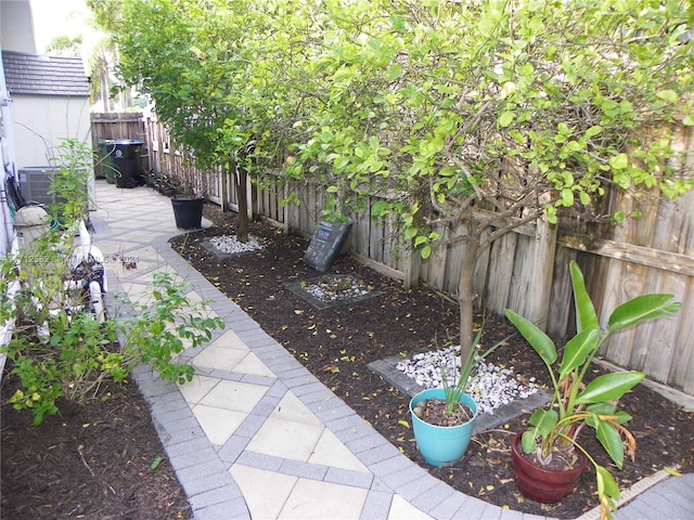 view of yard with a patio and central AC