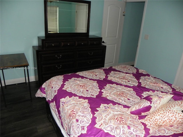 bedroom with hardwood / wood-style flooring and a closet