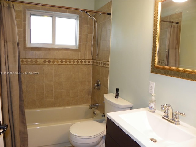 full bathroom featuring vanity, toilet, and shower / tub combo with curtain