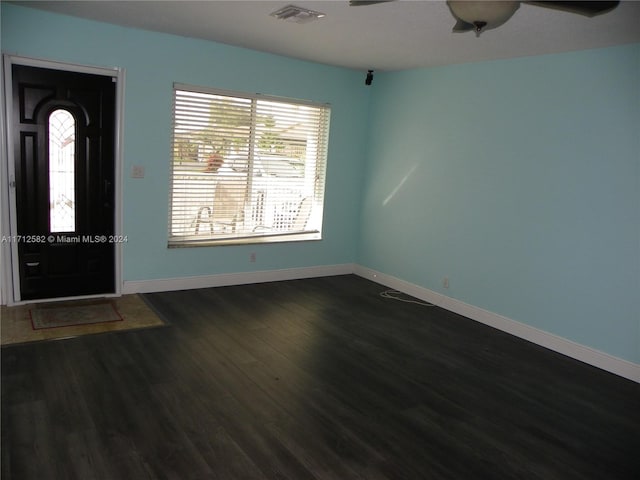 entrance foyer with ceiling fan and dark wood-type flooring