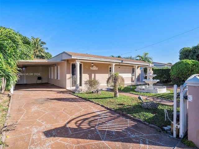 ranch-style home with a carport