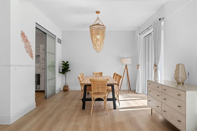 dining room with light wood-type flooring