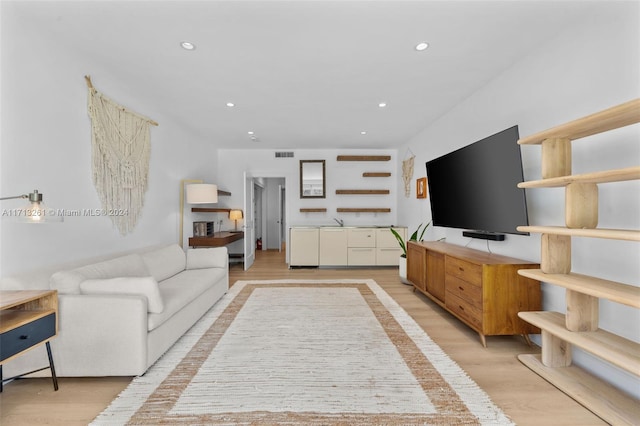 living room with light hardwood / wood-style flooring