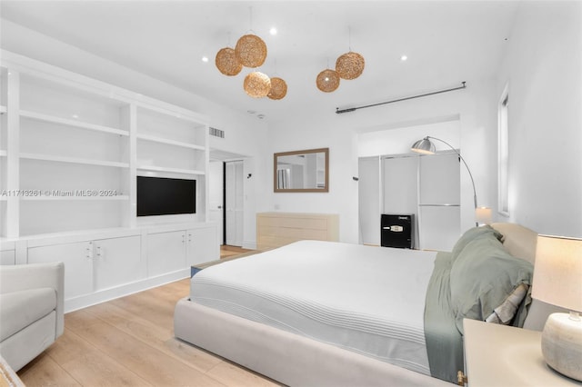 bedroom with light wood-type flooring