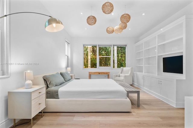 bedroom with light hardwood / wood-style floors