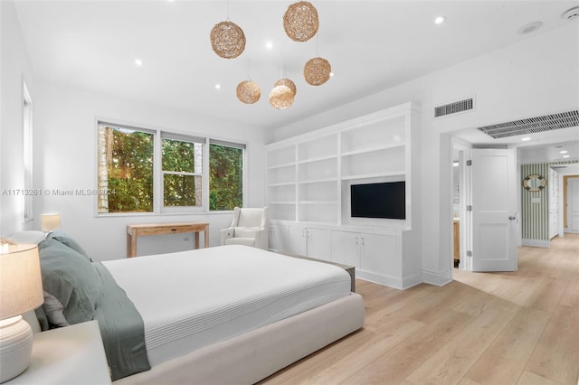 bedroom with light wood-type flooring