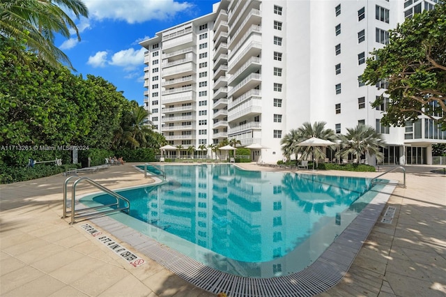 view of swimming pool featuring a patio area