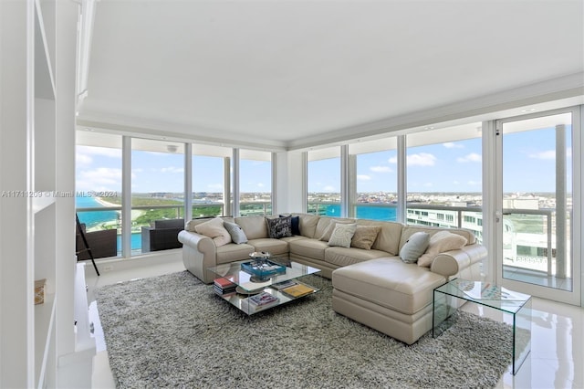 sunroom / solarium with a water view and a healthy amount of sunlight