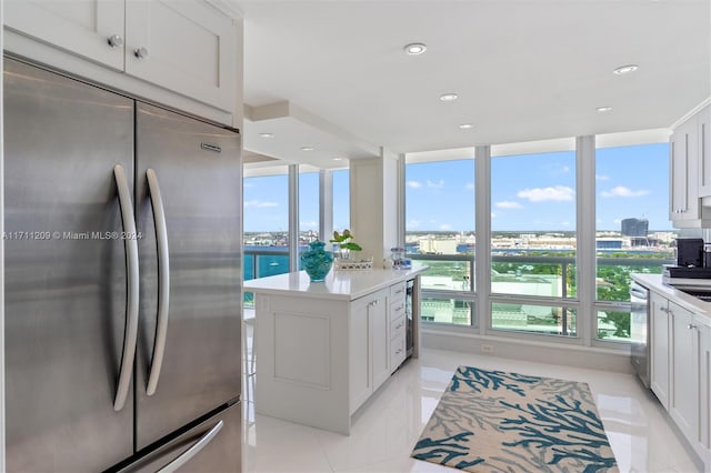 kitchen featuring a center island, white cabinetry, and stainless steel appliances