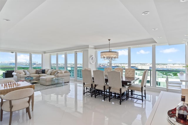 dining room featuring a chandelier, light tile patterned floors, and floor to ceiling windows