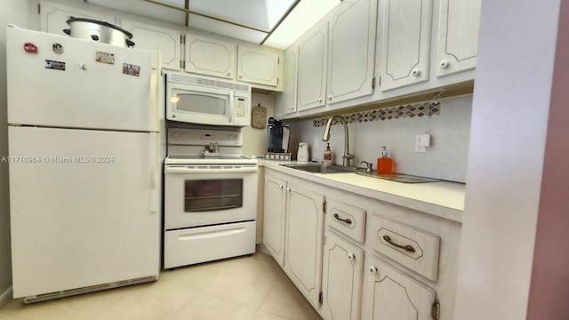 kitchen featuring sink and white appliances