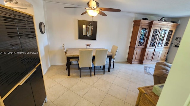 tiled dining room with ceiling fan