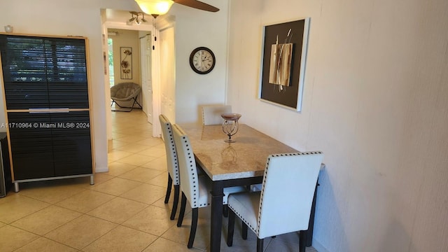 dining room featuring tile patterned floors and ceiling fan