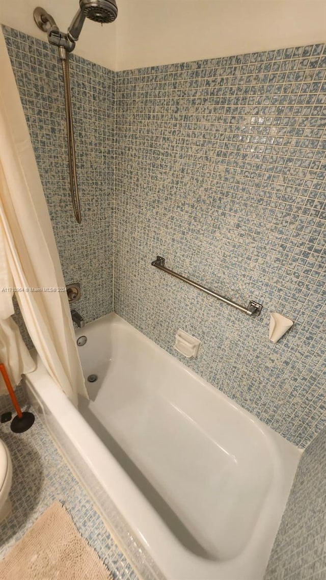 bathroom featuring shower / bath combination with curtain