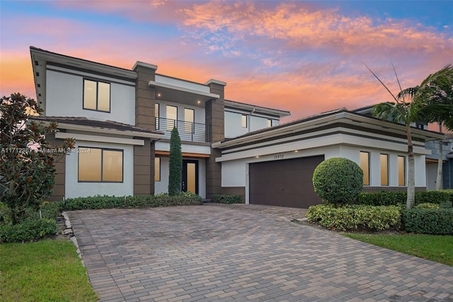 view of front of house with a balcony and a garage