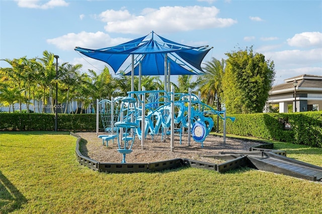 view of playground with a lawn