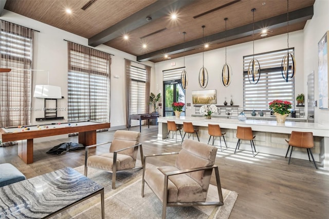 interior space featuring beam ceiling, light hardwood / wood-style flooring, a towering ceiling, wood ceiling, and pool table