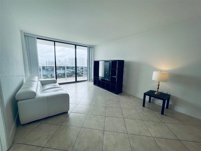 tiled living room with a wall of windows