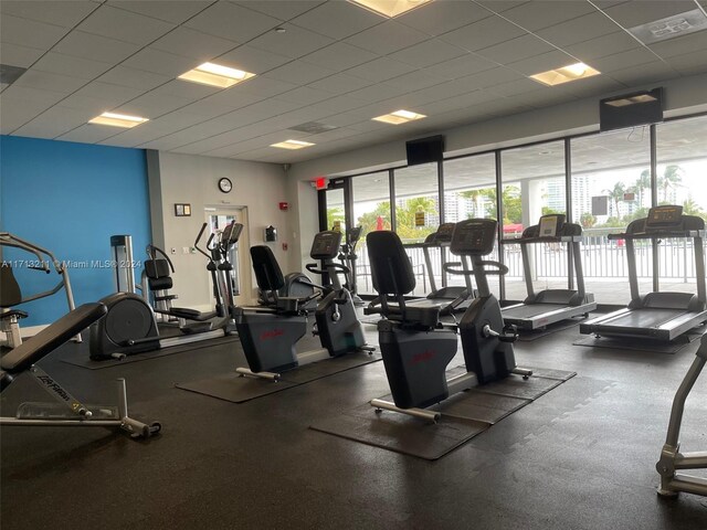 workout area with a paneled ceiling