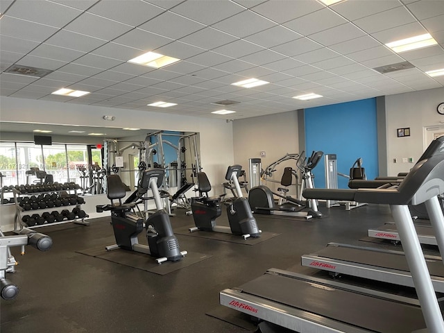 gym featuring a paneled ceiling