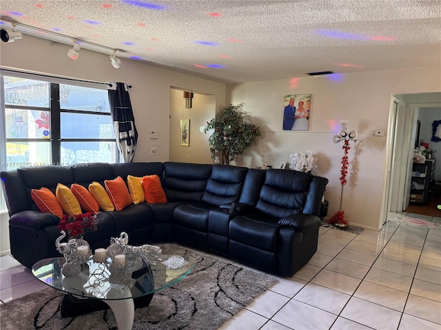 tiled living room with a textured ceiling