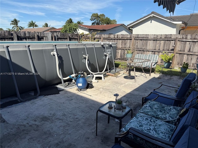 view of patio featuring a fenced in pool