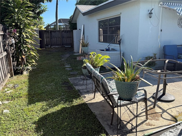 view of yard featuring cooling unit and a patio area