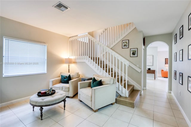 living room with light tile patterned floors