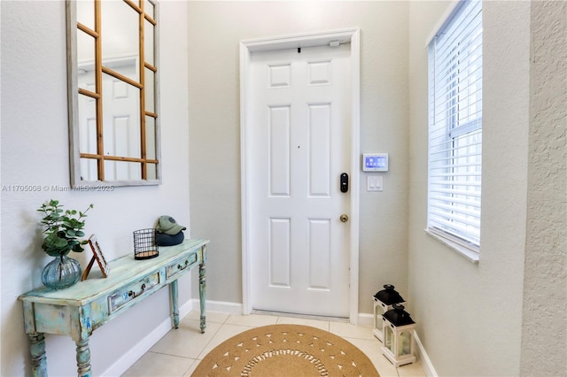 entrance foyer with light tile patterned flooring