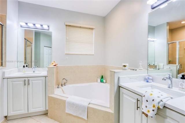 bathroom featuring tile patterned floors, separate shower and tub, and vanity