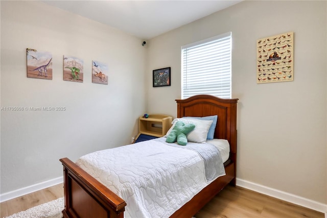 bedroom with light hardwood / wood-style floors