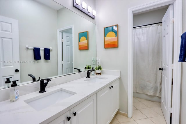 bathroom featuring walk in shower, vanity, and tile patterned flooring