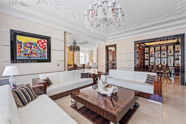 living room featuring an inviting chandelier and a tray ceiling