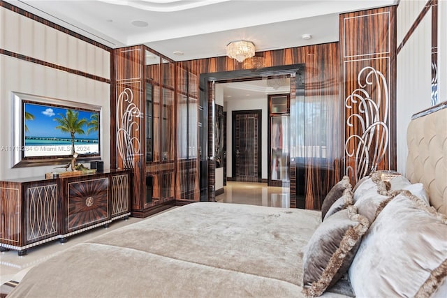 bedroom featuring an inviting chandelier